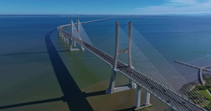 Aerial view of Vasco da Gama bridge crossing the Tagus river in Lisbon, Portugal. Modern design