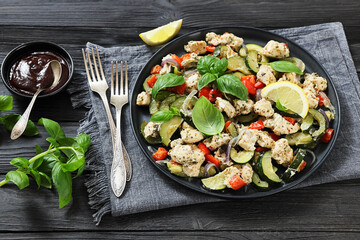 baked italian chicken and vegetables on a plate