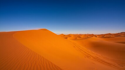 Stunning orange sand dunes under a vivid blue sky