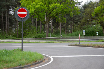 “No entry” road sign at a street exit in Europe, emphasizing traffic safety and caution, preventing unauthorized vehicle access and ensuring road order.