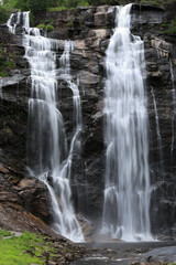 Vertical photo with a view of Skjervefossen waterfall at sunset near Bergen in Norway