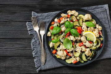 baked italian chicken and vegetables on a plate