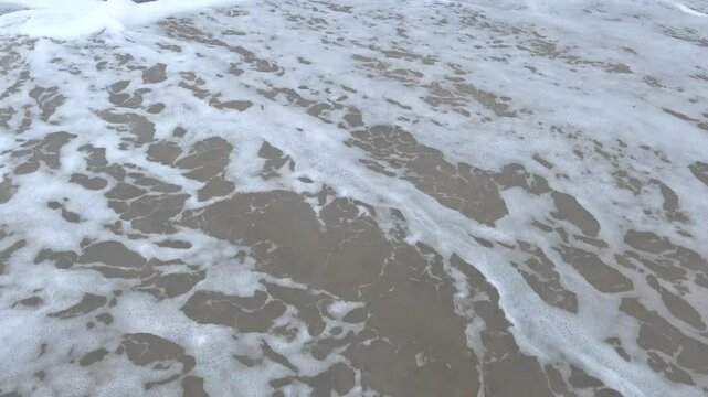Hirtshals, Denmark Rough surf and undertow on a North Sea beach. 