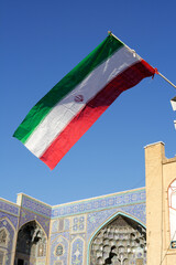 Iranian flag with the mosque of the Sheikh Lotf Allah Mosque in Isfahan, Iran