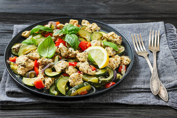 baked italian chicken and vegetables on a plate