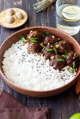 Beef meatballs in teriyaki sauce with rice. Asian food.