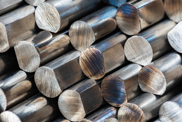 Steel rods displaying the metal structure, stacked  products of the metallurgical industry