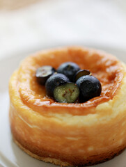 High-angle shot of cheesecake with fresh blueberries