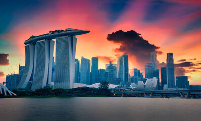 Singapore Skyline and view of skyscrapers on Marina Bay at twilight time.