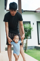 At home, a baby plays with their parents and aunt, sharing moments of laughter and occasional tears. The lively atmosphere reflects the warmth, joy, and emotional ups and downs of family life.
