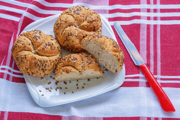 Sesame Kaiser Rolls (Emperor roll, kajzerica), round bread rolls on  white plate