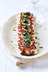 Open-faced toasted cheese sandwich on white background.	