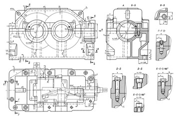 Engineering mechanical drawing of steel devices
- worm gear housing (reducer, gearbox, engine)
with dimension lines.
Cad scheme on paper sheet. Technology background
of machine building industry.