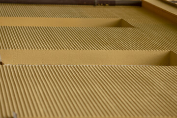 The image highlights the layered ridge structures in an industrial setting, showcasing textures and patterns that enhance visual interest and capture the complexity of modern design