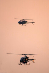 Military helicopter air attack by a squadron during dawn
