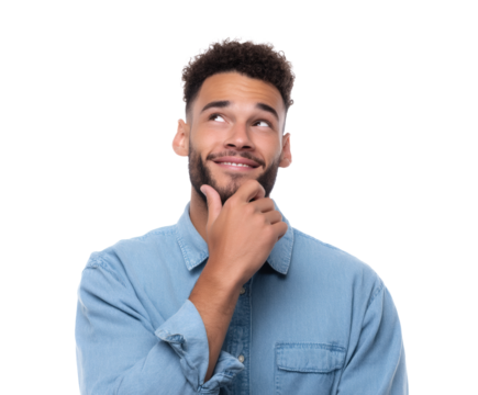 A young man in a denim shirt looks up thoughtfully, with a smile and hand on chin.