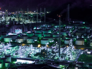 Factory-oil and gas industry, Oil refinery industrial plant at night, oil and gas chemical tank with oil refinery plant background at twilight, business power and energy chemical barrel
