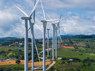 Find the support type and plan that works best for your needs, wind turbines on a green field with clouds and blue sky and a mountain range in the distance, north of waterton- alberta
