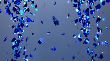 Shiny blue confetti is falling against a light grey background with light rays passing through, creating a celebratory and festive atmosphere - Powered by Adobe