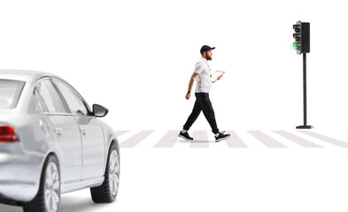Full length profile shot of a sports coach walking on street at zebra crossing