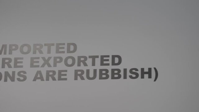 This video shows a panning of a negative self affirmation about art, commerce, and human existence. 