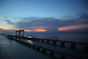 sunset at the pamban railway bridges, connecting pamban and rameshwaram island to mainland,...