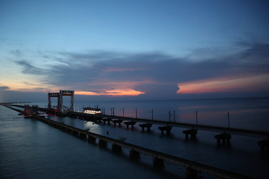 sunset at the pamban railway bridges, connecting pamban and rameshwaram island to mainland, ramanathapuram,tamilnadu India asia 
