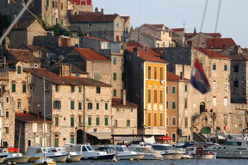 Historical buildings and boats on the coast of Sibenik, Croatia.