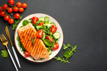 Healthy food plate, keto diet on black background.