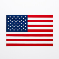 Fototapeta premium United States national flag with 50 white stars and 13 red and white stripes on a clean white background. Symbol of American identity, patriotism, and national holidays.