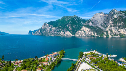 Drone view of northern Lake Garda near Torbole, Linfano. Surrounded by mountains, clear turquoise...