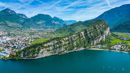 Drone view of northern Lake Garda near Torbole, Linfano. Surrounded by mountains, clear turquoise...