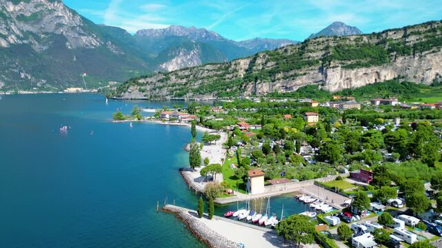 Drone view of northern Lake Garda near Torbole, Linfano. Surrounded by mountains, clear turquoise water, beaches, campings, and Monte Brione&mdash;perfect for nature, sport, and summer vacations