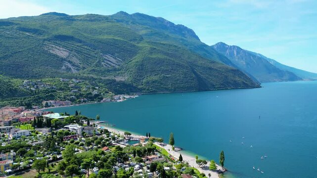 Drone view of northern Lake Garda near Torbole, Linfano. Surrounded by mountains, clear turquoise water, beaches, campings, and Monte Brione&mdash;perfect for nature, sport, and summer vacations
