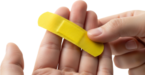 A close-up of a hand holding  an adhesive bandage (band-aid) against a transparent background, ideal for medical, health, or first aid-themed designs