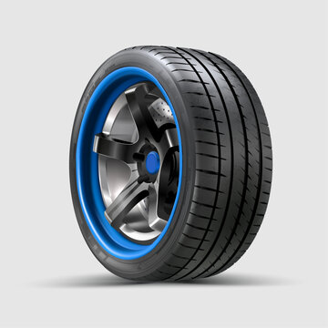 Modern sports tire with aluminum disc on white background.