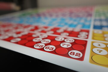 printing of colored and numbered game cards called bingo in the printing house. selective focus