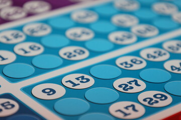 printing of colored and numbered game cards called bingo in the printing house. selective focus