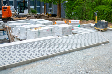 construction site showing new concrete foundation and drainage installation, Urban infrastructure development with newly paved sections and earthworks