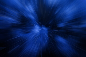 Blue light beams radiating outward in a dynamic motion blur effect