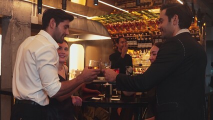 Man with couple standing fronted bar while friend walking to cheers cocktail in Paloma, Margarita, Old fashioned and Martini while bartender making special party beverage vibrant nightclub. Vinosity.