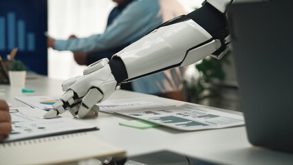 A stunning scene highlighting a robotic arm interacting with human colleagues in a modern office. The image emphasizes teamwork and innovation in the tech-driven workspace.Noogenesis