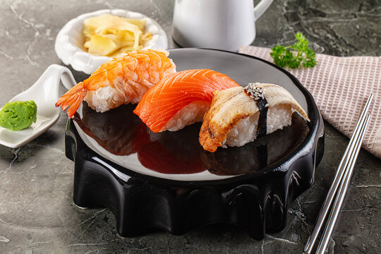 Japanese cuisine - sushi with eel, salmon and prawn