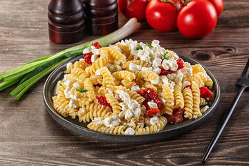 Italian pasta fusili with curd