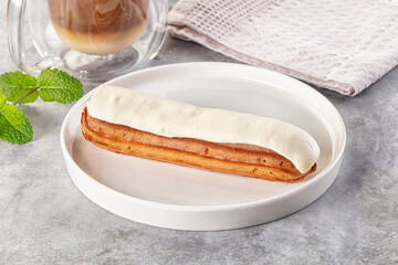 White vanilla eclair with icing