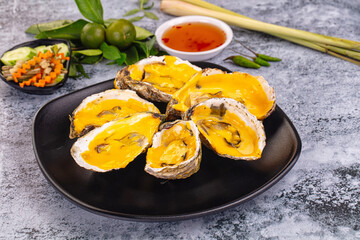 Baked oyster with cheddar cheese