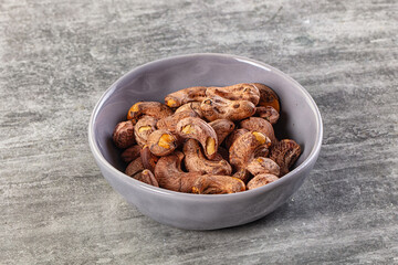 Unpeeled cashew nuts in the bowl