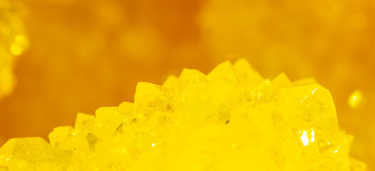 Golden crystal mineral stone. Gems. Mineral crystals in the natural environment. Texture of...