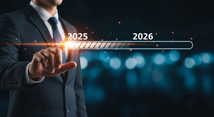 Progress Towards 2026 - Businessman interacting with a progress bar showing advancement from 2025 to 2026. Future planning concept