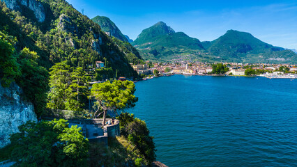 Aerial view of Riva del Garda with Torre Apponale, MAG museum, bike paths, boats and river ferries...